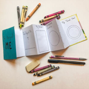 The constructed accordion book with writing prompts and writing supplies