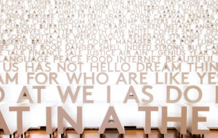 A wall of three-dimensional words with more common words at the bottom and less common ones at the top